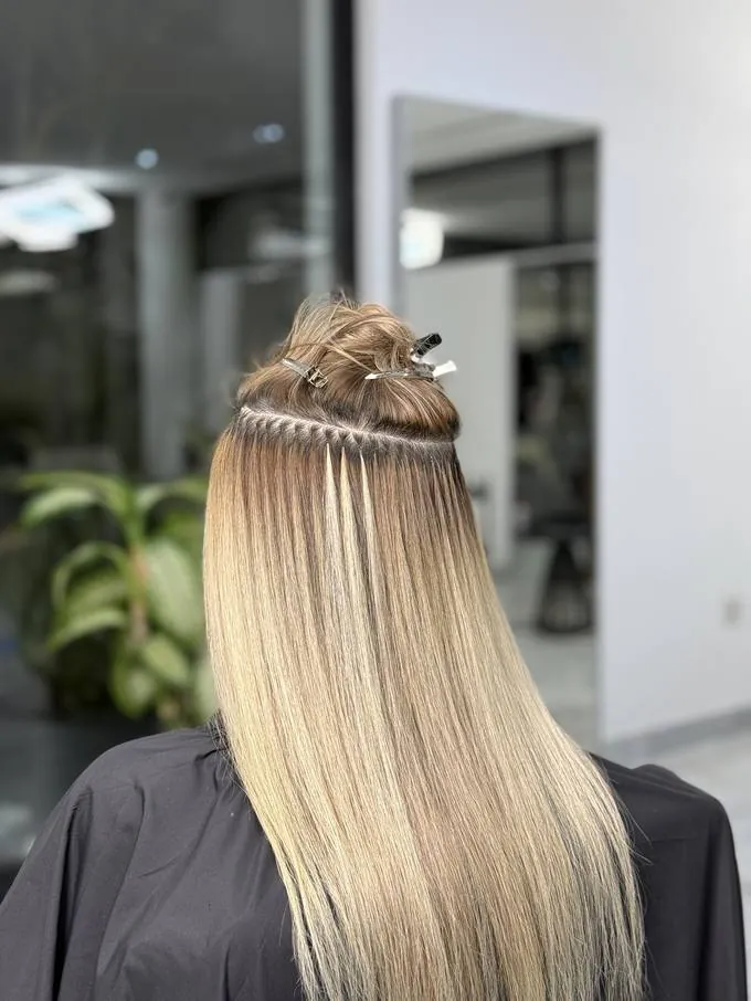 Capsules placed in a row along the parting, blended into the natural colour