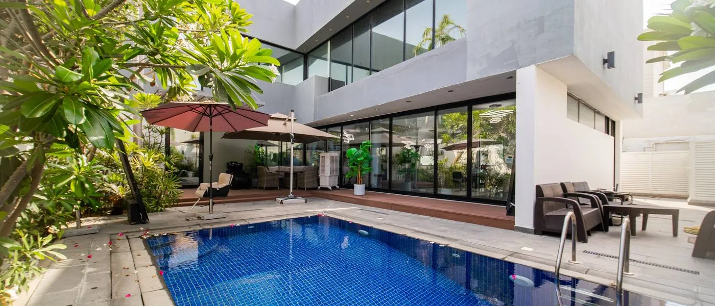 Pool courtyard of the Vereya Hair Dubai villa, with the studio behind full-height glazing